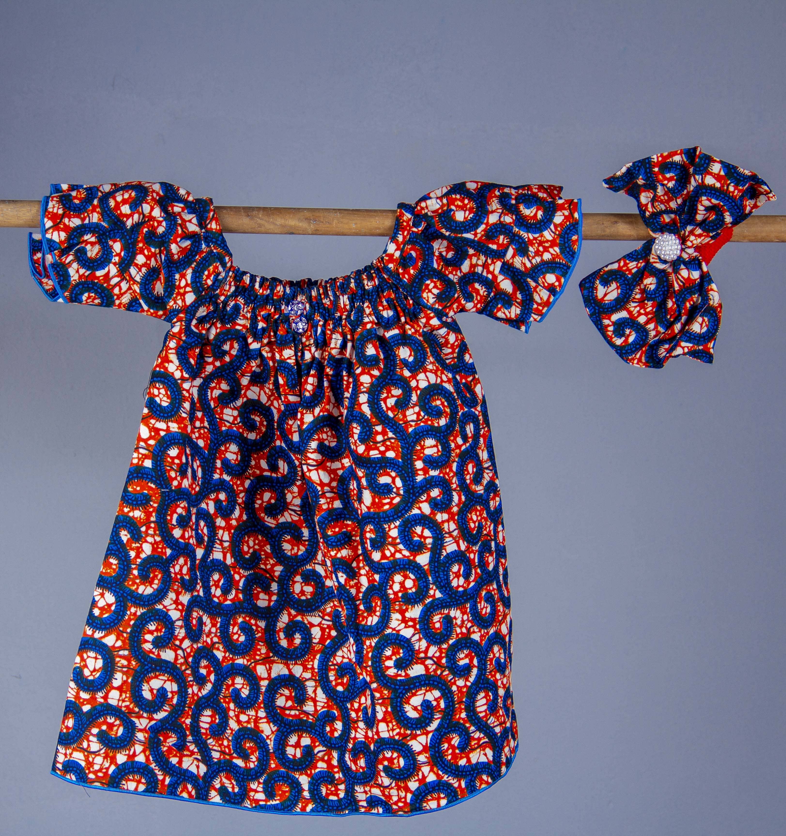 Robe pour bébé « Twist & Pop »